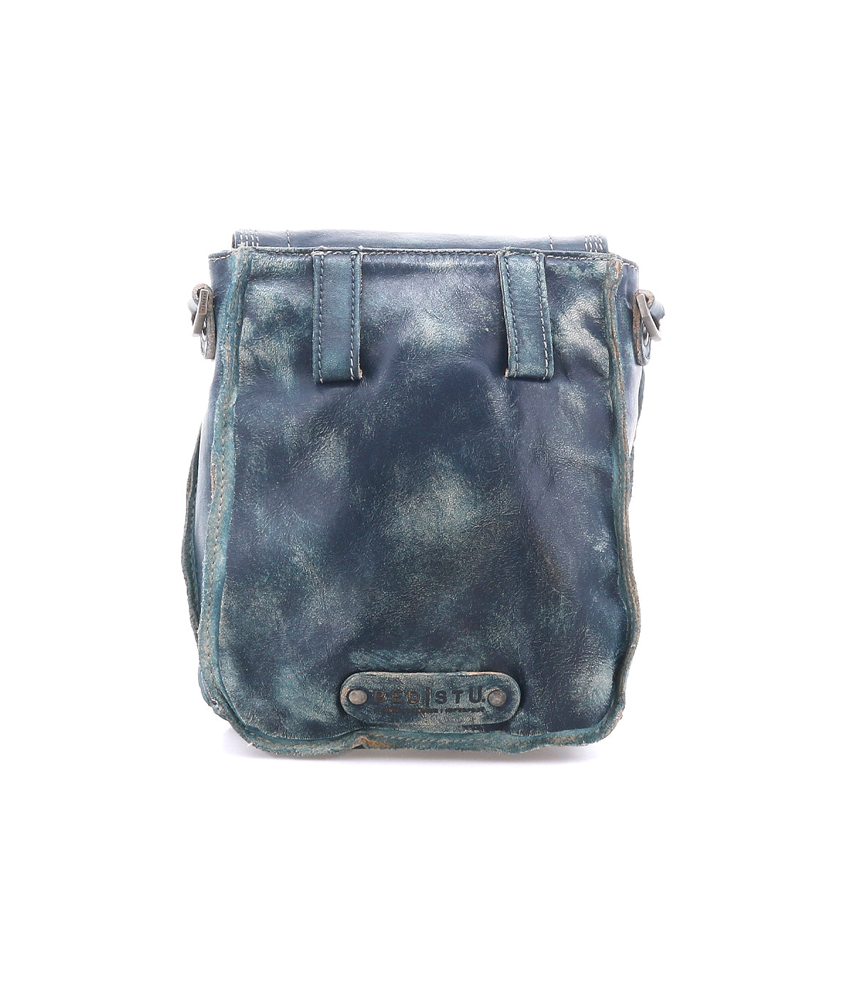 The Bed|Stü Rhyme, a dark blue leather crossbody bag featuring visible creases and a rectangular patch at the bottom center, is photographed against a white background and offers a stylish hands-free option for everyday carry.