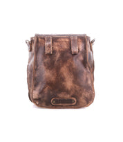 The Rhyme crossbody bag by Bed|Stü features distressed brown leather, visible stitching, and a "BED|STÜ" label on the front. Designed for hands-free convenience, it is photographed against a white background.