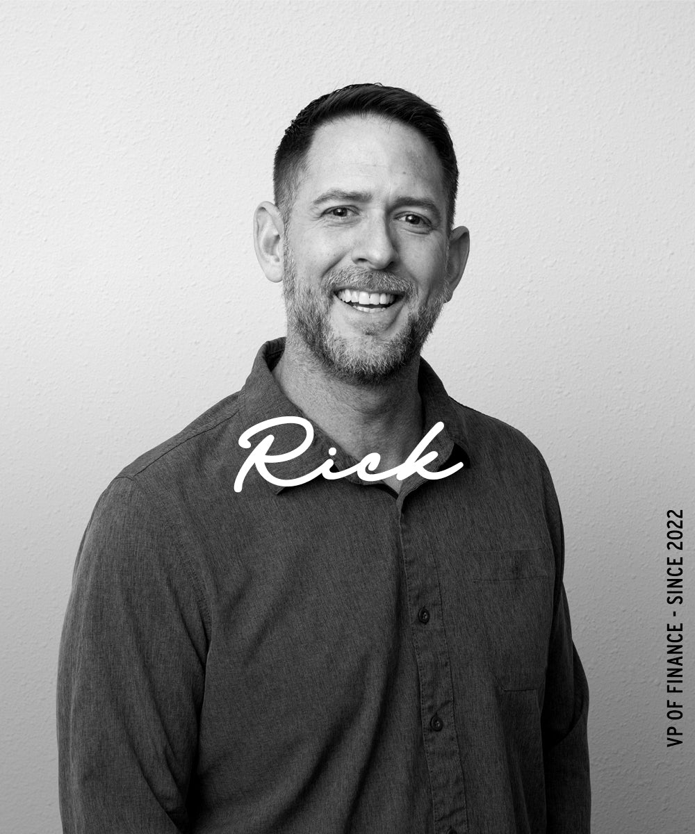 Black-and-white portrait of a smiling man with the name “Rick” overlaid and vertical text reading “VP of Finance · Since 2022.”