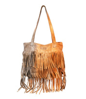 Introducing the Rimes by Bed|Stü—a handcrafted tan leather tote bag featuring dual handles and distinctive layered fringe detailing along the bottom and front. Its spacious interior provides ample room for all your daily essentials, combining practical functionality with eye-catching style.