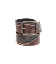 Distressed brown Riven leather belt by Bed|Stü, featuring a rectangular silver buckle and layered design with visible fading—ideal for everyday wear.