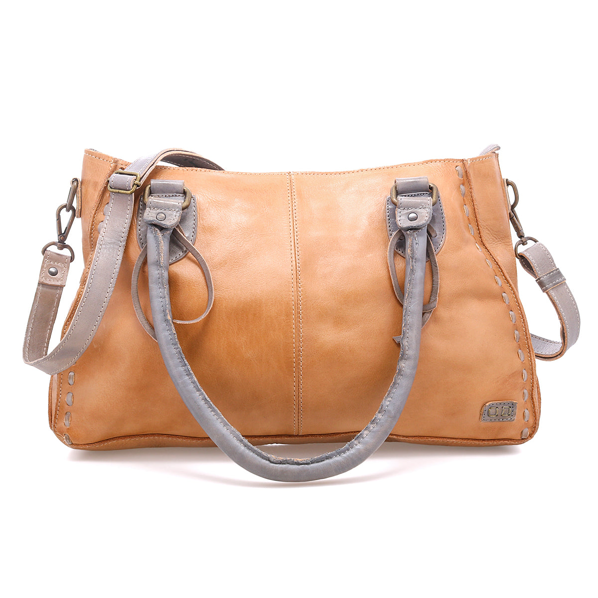 Introducing the Rockababy by Bed|Stü: a compact tan leather bag with gray handles and an adjustable crossbody strap, expertly crafted from vegetable-tanned leather. It features stitched detailing and a small metal Bed|Stü tag on the front.