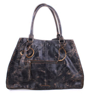 The Rockaway by Bed|Stü is a full-grain leather handbag in distressed black, featuring two sturdy handles, a front zipper pocket, and visible worn patches on its surface, presented against a plain white background.