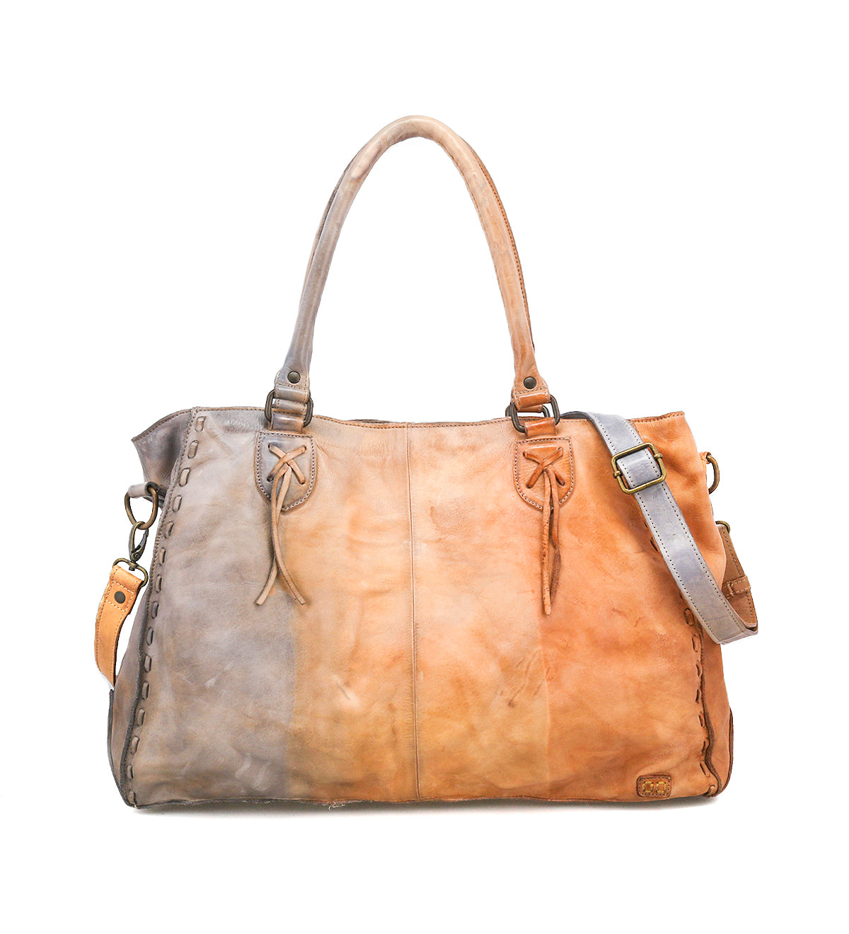 The Rockaway by Bed|Stü is a leather handbag crafted from luxurious full-grain leather in gradient brown tones, featuring dual top handles, a detachable shoulder strap, and decorative edge stitching—combining timeless elegance with everyday functionality.
