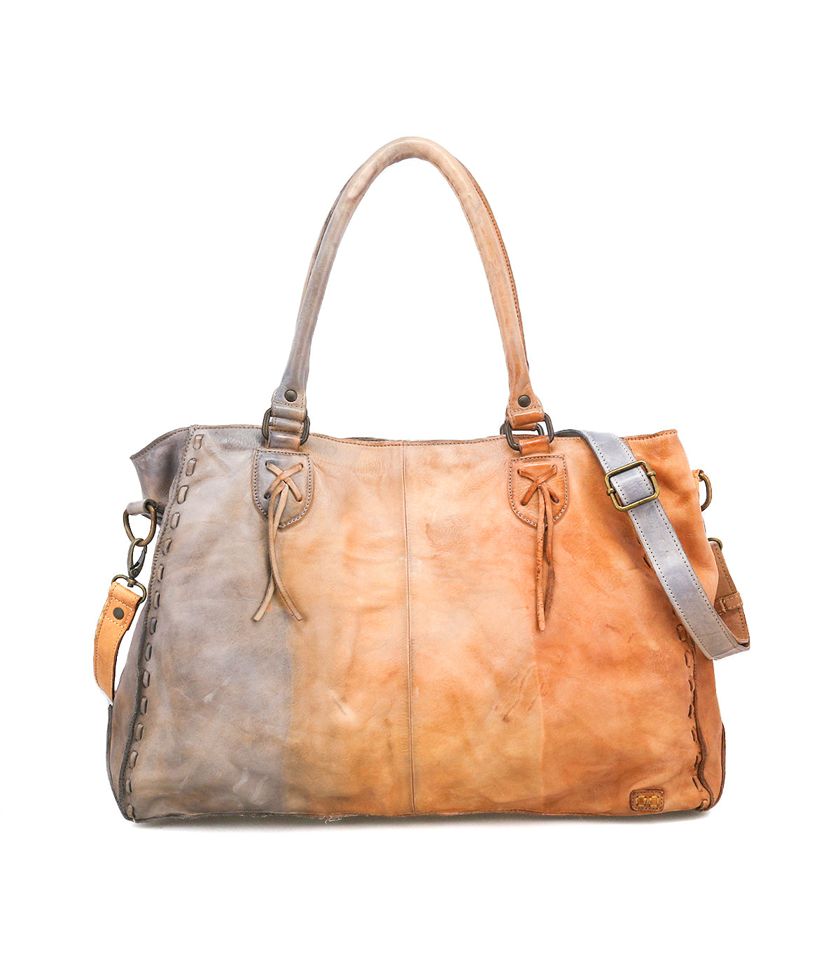 The Rockaway by Bed|Stü is a leather handbag crafted from luxurious full-grain leather in gradient brown tones, featuring dual top handles, a detachable shoulder strap, and decorative edge stitching—combining timeless elegance with everyday functionality.