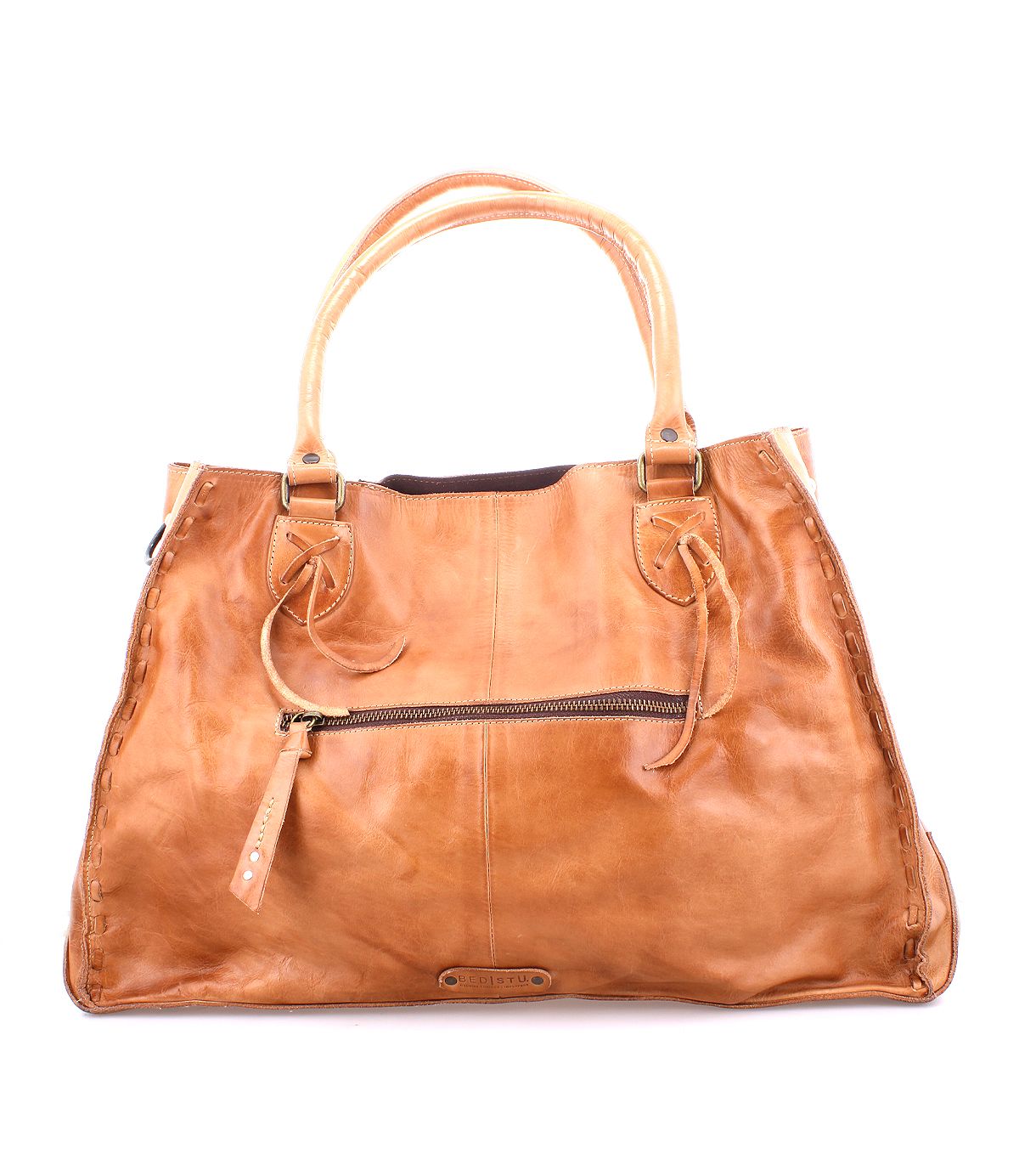 The Bed|Stü Rockaway is a large tan handbag made from full-grain leather, featuring two handles, a front zipper pocket, and visible edge stitching for everyday functionality, shown against a white background.