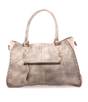 Introducing the Rockaway by Bed|Stü—a spacious, light gray handbag made from full-grain leather, featuring dual handles, decorative edge stitching, a front zipper pocket, and two knotted leather accents at the top corners. Designed for everyday use, it offers both style and durability.