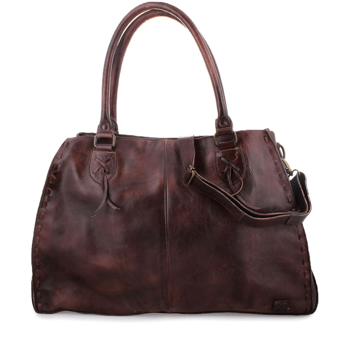 The Bed|Stü Rockaway is a large, dark brown full-grain leather handbag featuring double handles and an adjustable shoulder strap, designed for everyday use and showcased against a white background.