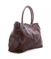 The Rockaway by Bed|Stü is a large brown full-grain leather handbag with double handles, visible stitching, and a textured surface, shown on a white background.