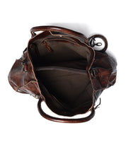 Top-down view of the open Rockaway bag by Bed|Stü, crafted from brown full-grain leather and designed for everyday function, featuring visible compartments—including a zippered pocket, fabric lining, and dual handles.
