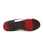 The image displays the worn sole of the Bed|Stü Rumba II men's lace-up leather dress shoe, showcasing black, brown, and red sections with visible branding and scuff marks—a testament to its stylish comfort and enduring design.