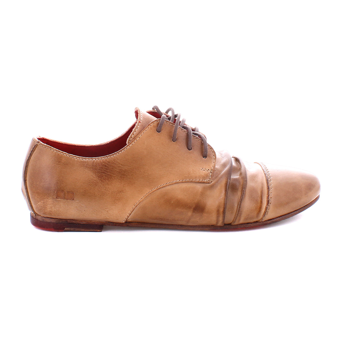 A single Rumba II lace-up dress shoe by Bed|Stü in tan leather, featuring dark laces, a low heel, visible creasing at the toe, and a slightly worn finish, is displayed on a white background. This classic design from Bed|Stü blends timeless appeal with stylish comfort.