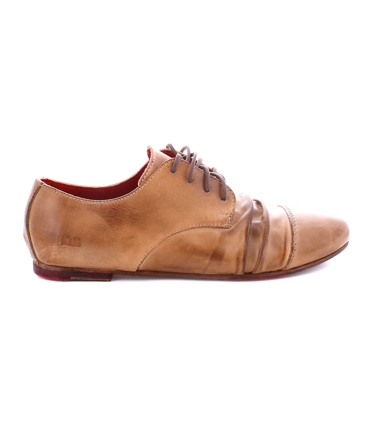 A single Rumba II lace-up dress shoe by Bed|Stü in tan leather, featuring dark laces, a low heel, visible creasing at the toe, and a slightly worn finish, is displayed on a white background. This classic design from Bed|Stü blends timeless appeal with stylish comfort.