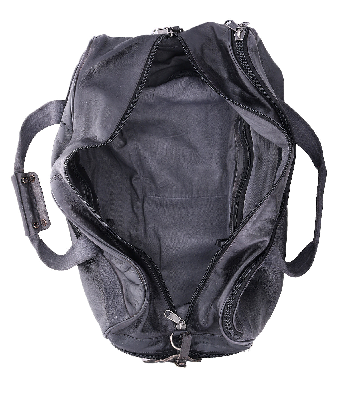 The Bed|Stü Ruslan travel bag, shown open and empty with visible handles and zippers, is photographed from above against a white background.