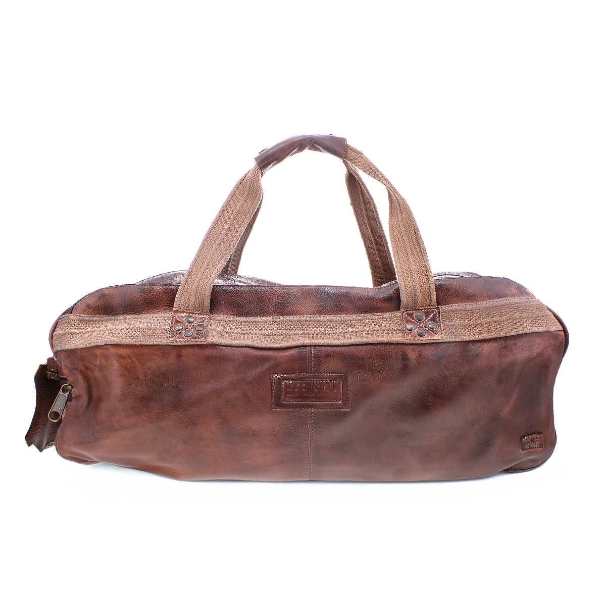 The Bed|Stü Ruslan is a brown leather duffel bag featuring durable beige canvas straps, a zipper closure, and a small front pocket. This leather travel duffel is shown on a white background.