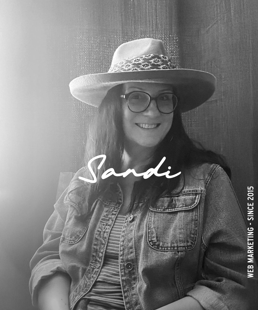 Black-and-white portrait of a woman with the name “Sandi” overlaid and vertical text reading “Web Marketing · Since 2015.”