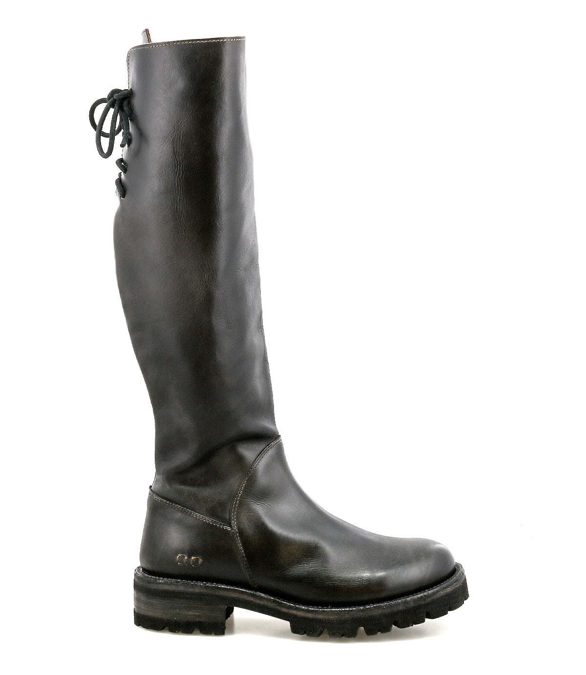 Introducing Scope by Bed|Stü: a tall boot made from sleek vegetable-tanned leather, designed with a side zipper, thick treaded sole, and distinctive lace-up detail along the back of the shaft—featured here in profile against a white background.