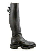 Introducing Scope by Bed|Stü: a tall boot made from sleek vegetable-tanned leather, designed with a side zipper, thick treaded sole, and distinctive lace-up detail along the back of the shaft—featured here in profile against a white background.
