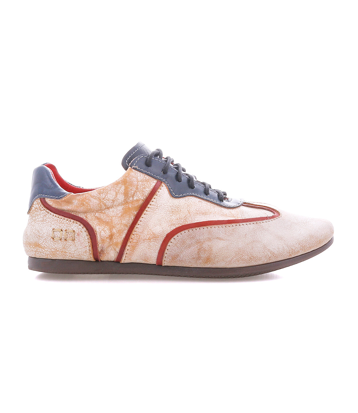 The Bed|Stü Scurry II is a beige and orange sneaker with gray laces and detailing, showcasing a lace-up design and low-profile silhouette, displayed in side profile against a white background.