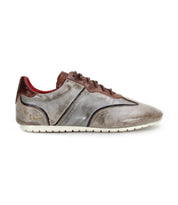 The Scurry by Bed|Stü is a gray and brown retro-inspired sneaker made from vegetable-tanned leather, featuring a white sole, brown laces, and a red inner lining, displayed in a left side profile view.