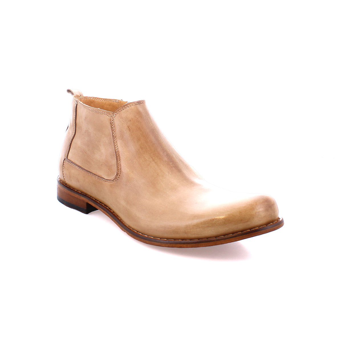 The Bed|Stü Seek is a tan leather Chelsea boot, handmade in Italy from vegetable-tanned leather, featuring a low heel and elastic side panels. Shown at an angle on a white background.