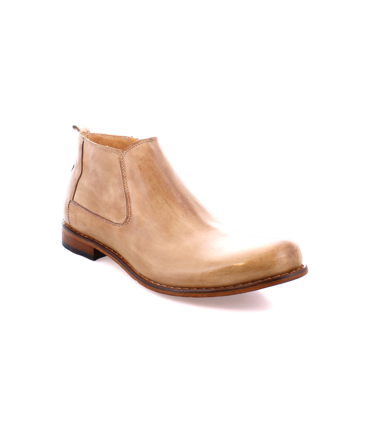 The Bed|Stü Seek is a tan leather Chelsea boot, handmade in Italy from vegetable-tanned leather, featuring a low heel and elastic side panels. Shown at an angle on a white background.