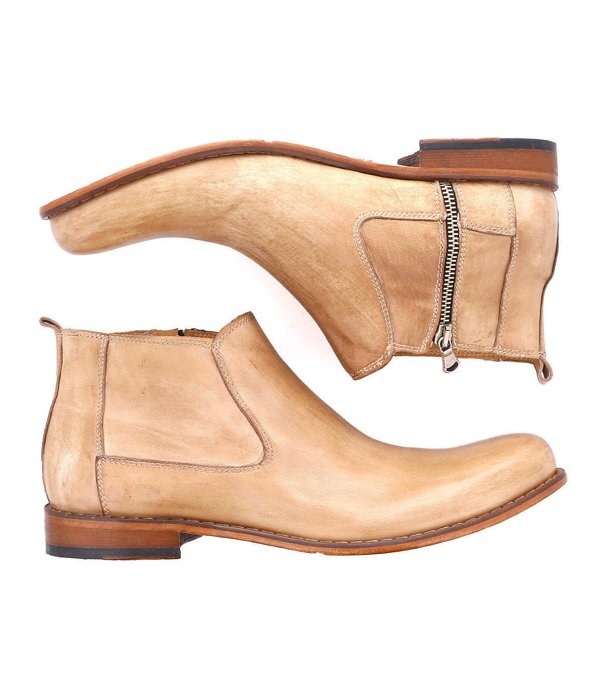 Pair of tan "Seek" ankle boots by Bed|Stü, handmade in Italy from vegetable-tanned leather, featuring side zippers and low wooden heels, displayed from side and bottom views on a white background.