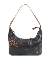 The Seemly shoulder bag by Bed|Stü is a compact black leather accessory, featuring brown strap and buckle detail accents, a secure zipper closure, and a small stitched patch on the front—perfect for everyday styling.
