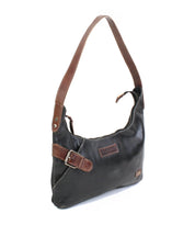 Introducing the Seemly by Bed|Stü: a compact black leather shoulder bag accented with a brown strap and buckle detail, a zippered top closure, and a small logo patch at the lower front corner—perfect for effortless everyday styling.