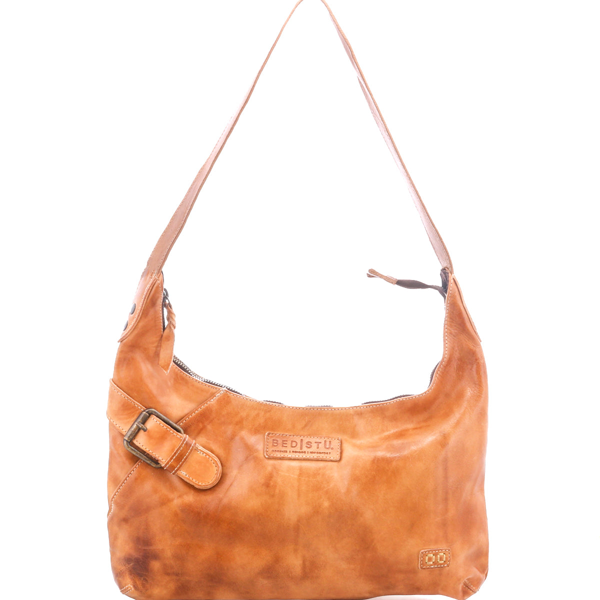 The Seemly by Bed|Stü is a light brown leather shoulder bag featuring a single strap, decorative buckle detail, visible stitching, and a zippered top. This compact bag is finished with logo and small patch accents on the front—perfect for everyday styling.