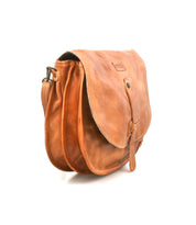 The Sequoia by Bed|Stü is a light brown vegetable-tanned leather satchel featuring a front flap, tab closure, and adjustable crossbody strap, photographed against a white background.