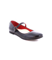 The Bed|Stü Shuffle III is a black Mary Jane ballet flat crafted from supple leather, featuring a thin strap with buckle and a red interior lining, displayed against a white background.