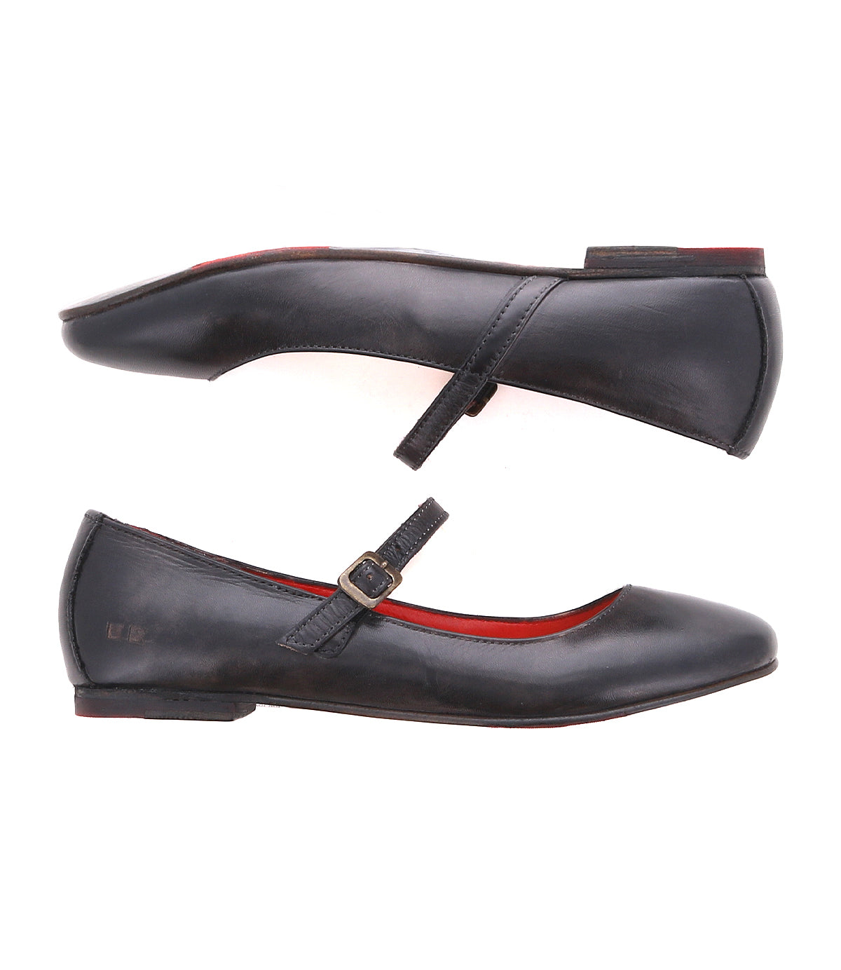 Two Bed|Stü Shuffle III black leather Mary Jane ballet flats featuring red lining, crafted from supple leather—one highlights the strap and buckle, while both are displayed side by side on a white background.