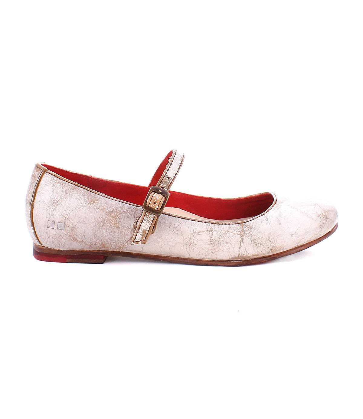 A side-profile image of the Bed|Stü Shuffle III, a worn beige Mary Jane ballet flat crafted from supple leather, features a buckle strap, red interior lining, and slight scuff marks, set against a white background.
