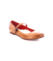 The Bed|Stü Shuffle III features tan supple leather in a Mary Jane ballet flat design with a buckle strap and red interior, displayed on a white background.