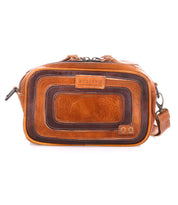 Introducing Shy by Bed|Stü—a rectangular brown leather crossbody bag showcasing a textured, layered front design. It features a top zipper closure, an adjustable shoulder strap for comfortable wear, and dual pockets that offer easy access and efficient organization of your essentials. The Bed|Stü brand name is displayed on a front leather patch.
