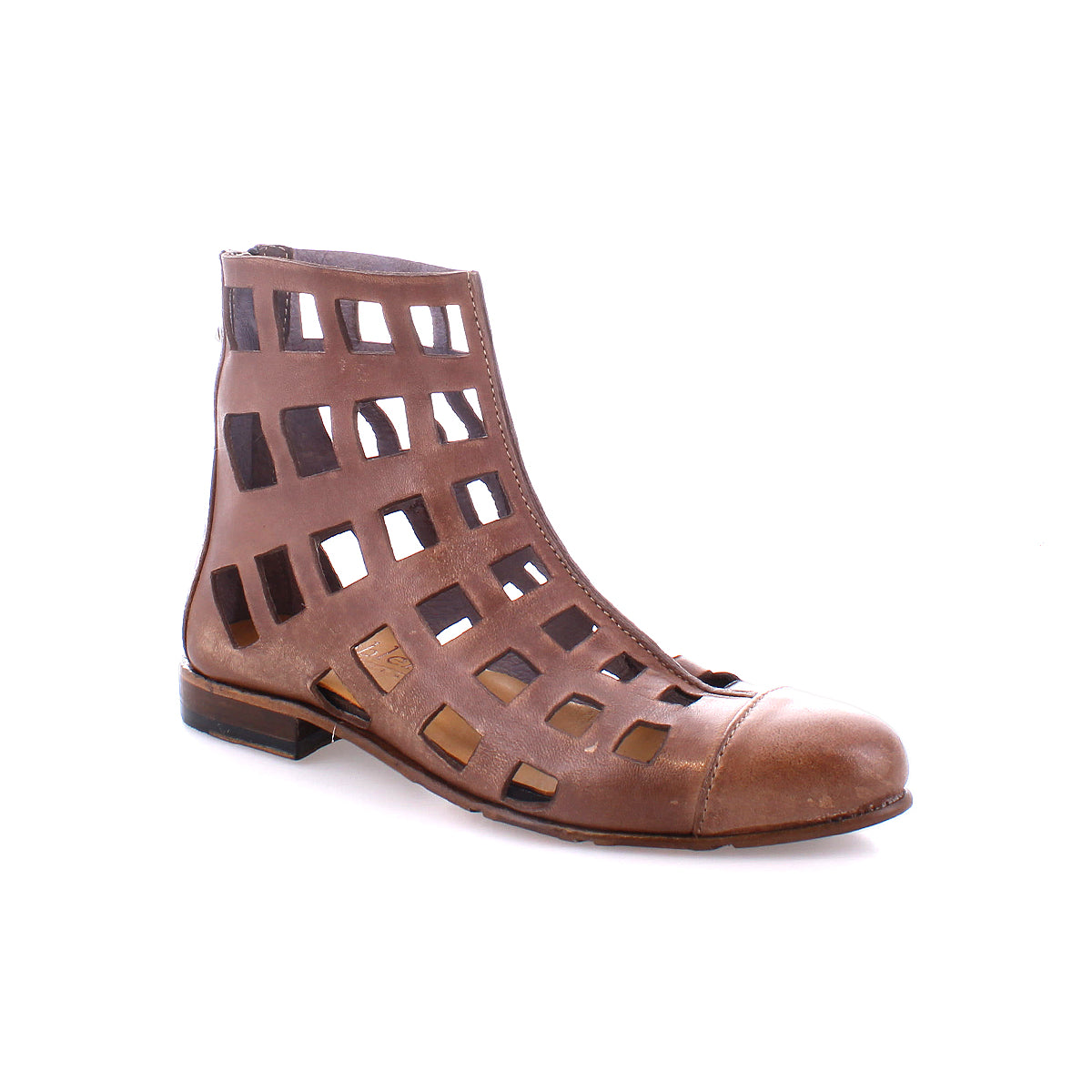 The Bed|Stü Skyline is a brown leather short boot featuring open square cutouts and a low heel, handcrafted in Italy and pictured from the side on a white background.