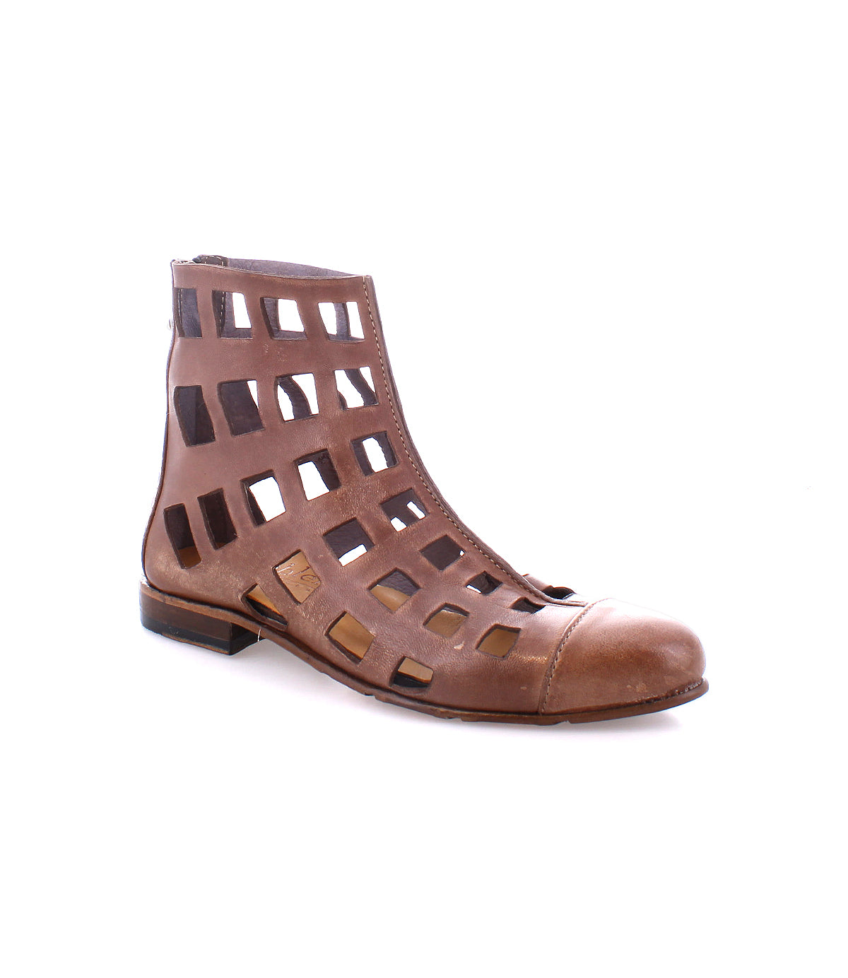 The Bed|Stü Skyline is a brown leather short boot featuring open square cutouts and a low heel, handcrafted in Italy and pictured from the side on a white background.