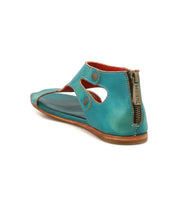 Introducing the Bed|Stü Soto—a turquoise leather sandal featuring side cutouts, prominent stitching, a back zipper closure, a low heel, and a cushioned footbed for all-day comfort—ideal for everyday adventures.