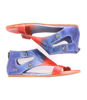 Step out in comfort with the Bed|Stü Soto sandals—a pair of flat, open-toe cutout leather sandals featuring blue and red gradient leather, side cutouts, decorative buttons, and convenient back zippers. Designed with a cushioned footbed for all-day comfort, the Soto is perfect for everyday exploring.