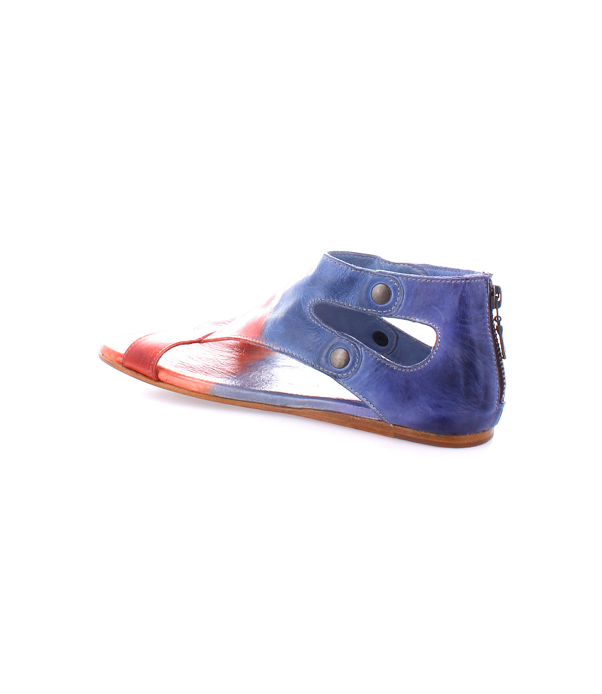 The Soto sandal by Bed|Stü features a flat leather cutout design with a striking red and blue gradient, side cutouts, metal snaps, and a back zipper—all set on a white background. Its cushioned footbed makes it perfect for everyday exploring.