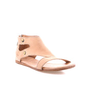 The Bed|Stü Soto sandals are tan cutout leather sandals featuring an open toe, ankle-high silhouette, side cutout details with metal button accents, a flat sole, and a convenient back zipper. Designed with a cushioned footbed for comfort during everyday exploring. Shown on a white background.