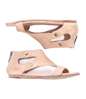 Two tan cutout leather "Soto" sandals by Bed|Stü, featuring open toes, brass snap details, and heel zipper closures, are shown from the side against a white background. Designed for everyday exploring, these sandals include a cushioned footbed to provide enhanced comfort with every step.