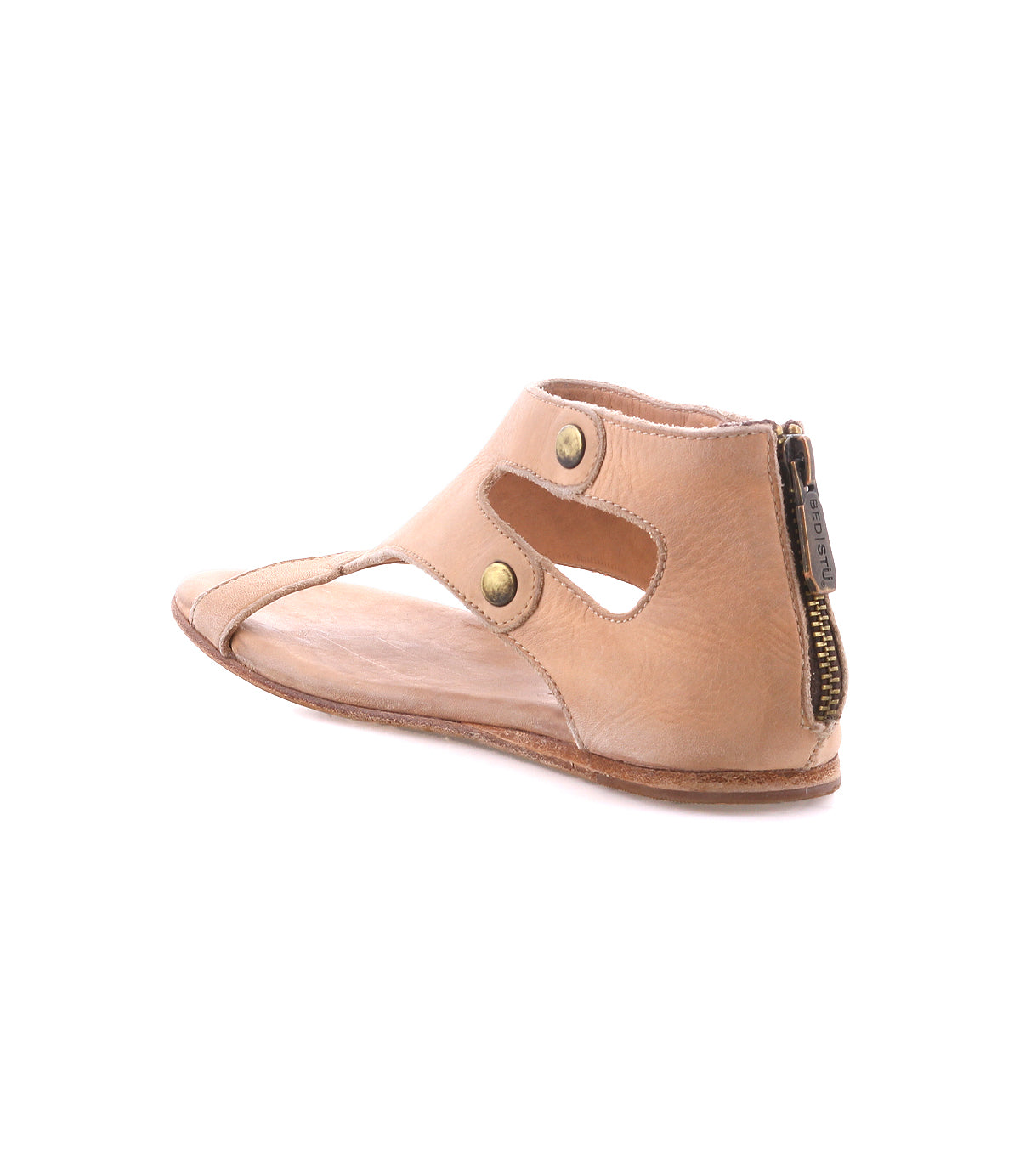 Bed|Stü Soto tan leather sandals feature cutout sides, front snap accents, a back zipper for easy wear, and a cushioned footbed—ideal for everyday adventures. Shown on a white background.