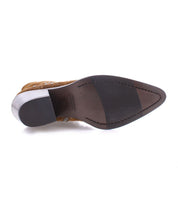The image shows the bottom view of the Sposa bootie by Bed|Stü, featuring brown vegetable-tanned leather with a pointed toe, a black rubber sole insert, and a light-colored heel.