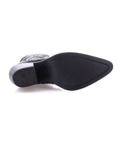 The image shows the bottom view of a single Sposa bootie by Bed|Stü, crafted from black vegetable-tanned leather, featuring a textured sole and a block heel.