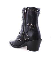 The Sposa by Bed|Stü is a black pointed toe bootie made from vegetable-tanned leather, adorned with decorative silver studs, featuring a chunky heel and a visible side zipper, shown against a white background.