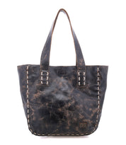 Introducing the Stevie by Bed|Stü—a distressed black leather tote bag featuring double handles and visible edge stitching. This timeless vintage piece is ideal for everyday carry and is elegantly displayed against a white background.
