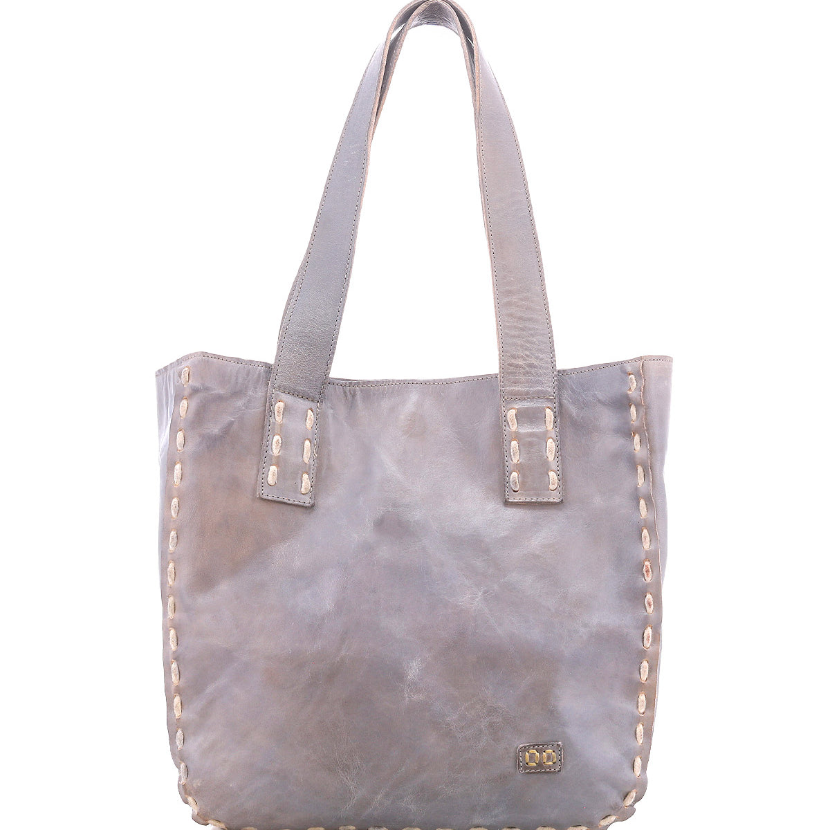 Introducing Stevie by Bed|Stü—a gray leather tote bag featuring double handles and decorative stitching along its edges. A small metal Bed|Stü logo plate accents the lower right corner. This classic tote seamlessly blends timeless style with everyday practicality, making it the perfect carryall for daily use.