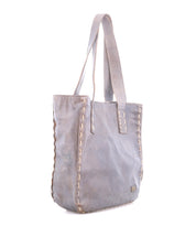 The Bed|Stü Stevie tote is a gray leather bag featuring double handles and stitched detailing along the sides, ideal for everyday carry, photographed on a white background.